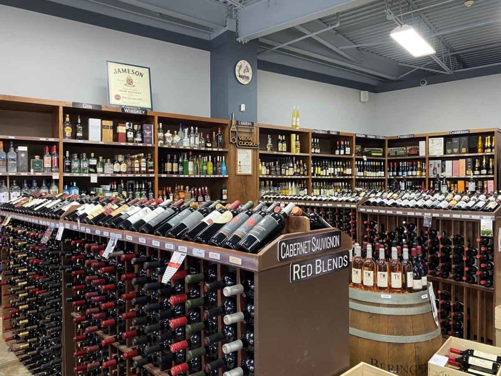 Wide shot of Leonard Park Wines store interior showing racks of wine and liquors